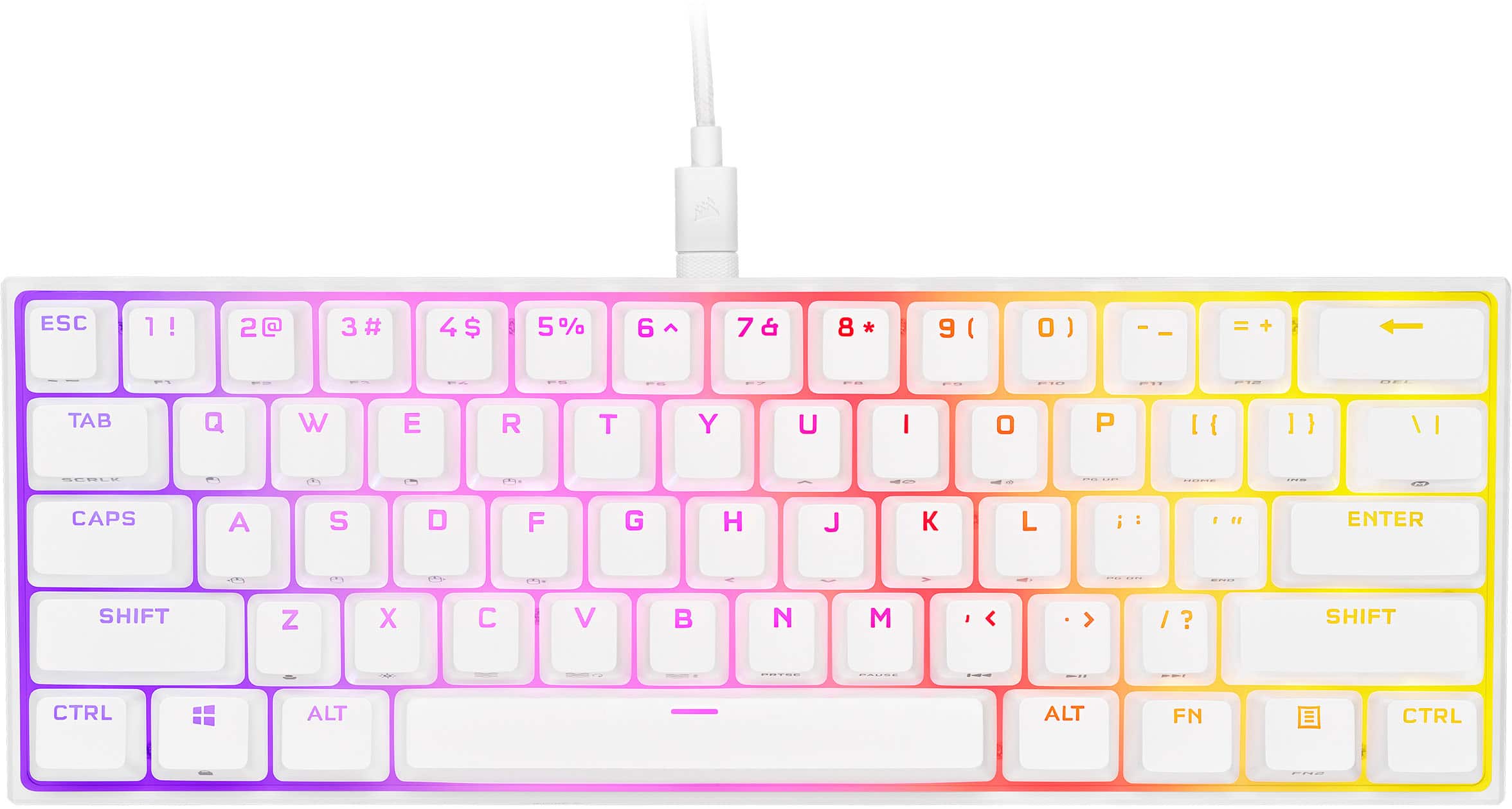 CORSAIR K65 RGB MINI keyboard on a gaming desk with RGB lighting